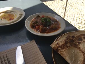 Part of vegetarian mezze (made vegan) : hummus, okra stew, syrian flat bread at Mezze in Lisbon