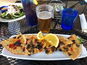 Hummus pizza. Costs extra $ to make vegan because of the gluten free crust even though they remove the feta at Secret Garden Cafe in Sedona