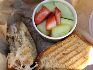 Tempeh, Sauerkraut, vegan cheese, on vegan bread and a cup of fruit. at Secret Garden Cafe in Sedona