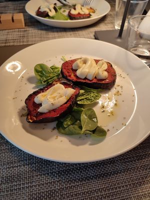 Eggplants topped with tomato sauce and vegan cheese at Azalea Park Hotel in Cavalese