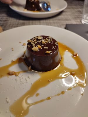 Chocolate pudding with chopped peanuts at Azalea Park Hotel in Cavalese