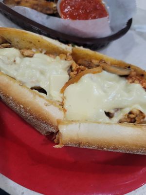 Veg "chicken" cheeze steak with provolone, marinara, onions, and mushrooms. Also, pictured the eggplant fries. at Fingers Wings and Other Things in Conshohocken