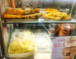 On top: pumpkin cake, yam cake, veggie fritter at He Hua Vegetarian 荷花素食 in Central Singapore