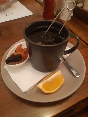 A green tea : served with a slice of lemon and some dried fruits #Veganuary at VegANGELov  in Belgrade