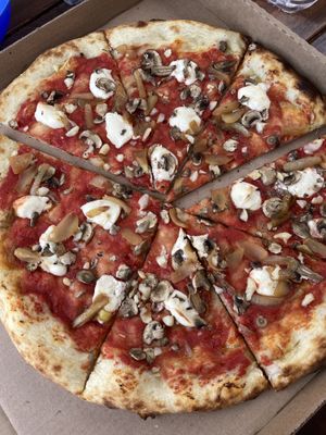 Mushrooms, grilled onions, garlic and mac nut cheeze   at Pau Pizza in Waimea