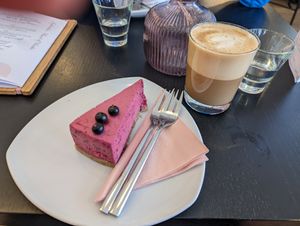 Blackberry mousse cake and flat white with oat milk at Jolie Lounge & Café in Aekaeslompolo