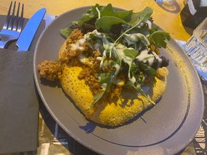 Vegan flatbread: sauteed soya minced "meat" with sweet peppers and onions, topped with fresh rocket and vegan sour cream! at Estrella Cosmos in Thessaloniki