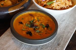 yellow daal tadka.
Gluten Free/Vegan.
yellow lentils. onion. tomato. cilantro. chili. indian spices. at Inchin's Bamboo Garden in Bellevue