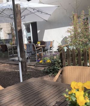 Cafe garden in the courtyard  at Snoopkraam in Hamburg