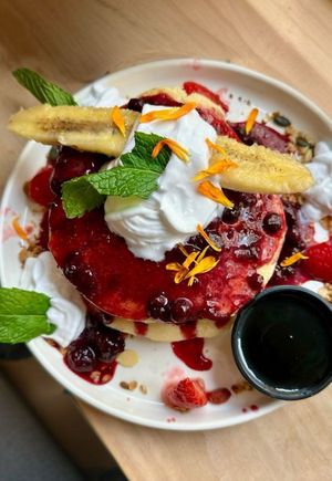 Red Pancakes with side of maple syrupp  at Brunchit in Malaga