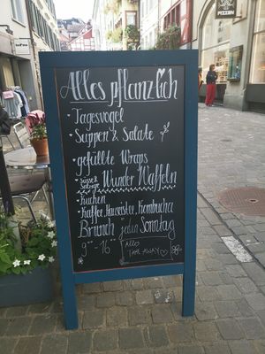 welcome board on terrace "all plant based" at Formidable Pelikan in St Gallen