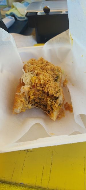 Reggi #1, With sauerkraut, relish, ketchup, mustard, our special sweet/spicy chili Mayo, then topped with some crispy onions! at Veggi Dogs in Honolulu