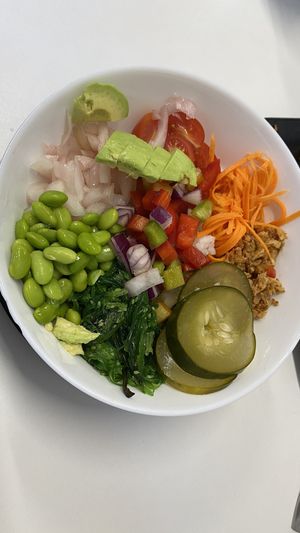 Rice bowl with tofu, cucumber, carrot, edamame, pepper, and ponzu sauce.  at Perro Sin Rabo in Tenerife