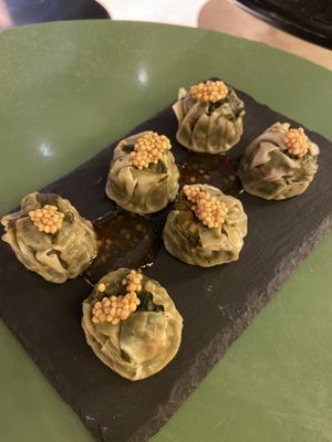 Vegan dim sum with mustard on top  at Wolf Sharing Food Market in Brussels