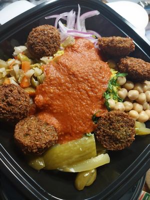 basmati, chickpeas, red onion, Arabic pickles, hot peppers, parsley, falafel and fire sauce at Pita or Bowl in Springfield