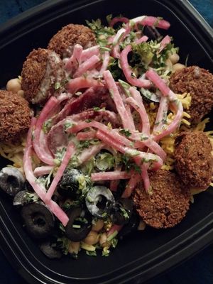 rice, chickpeas, black olives, sliced beets, pickled turnips, parsley, falafel and tahini at Pita or Bowl in Springfield
