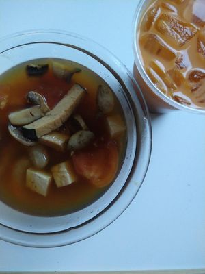 seafood tom yum and thai iced tea at Urban Vegan - Lake View in Chicago