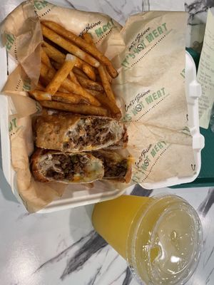 Philly cheesesteak egg rolls and seasoned fries  at Can't Believe It's Not Meat - Chicago Ave in Chicago