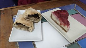 Empanada queso y championes, y cheesecake at Violeta Dulceria Vegana in Valparaiso