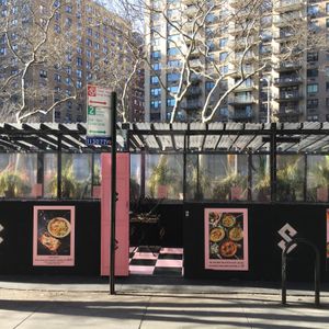 Outdoor tables for eating at Pizza Collective in New York City