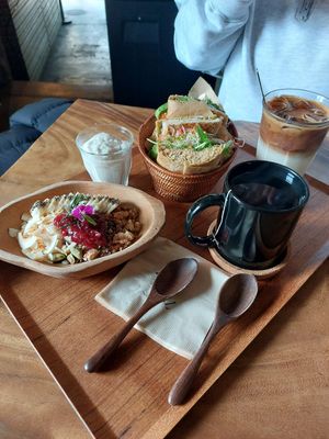 Soy yogurt bowl to the left. (Non vegan meal to the right) at The Royal Food & Drink in Seoul