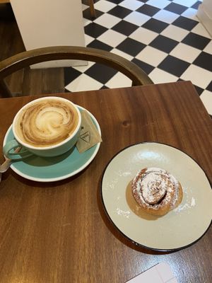 Cappuccino and cinnamon roll  at Hygge in Lisbon