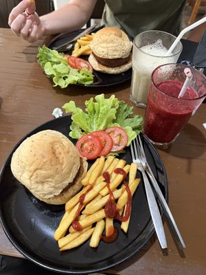 Vegan meat-free burgers and fries with smoothies.  at Veggie Tales x Wagging Tales Cafe in Hua Hin