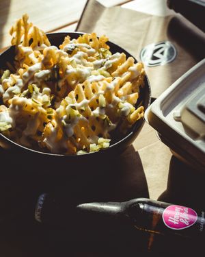 Pickle Dilly fries basking in the sun at Mavericks Burger Co in Toronto