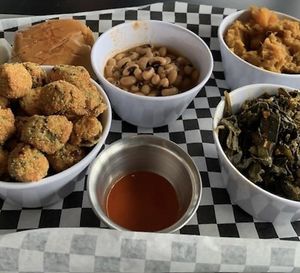 Southern Sides: Black-eyed peas, yams, collard greens, and fried okra.  at the hive vegan eatery in Houston