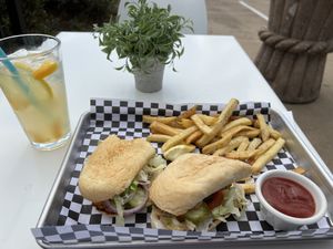 Vegan oyster mushroom po boy, fries and mango lemonade!  I was hungry and took a bite before the photo;)  at the hive vegan eatery in Houston