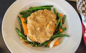 The Hive Bowl - Gardeins over mashed potatoes with mushroom gravy and veggies at the hive vegan eatery in Houston