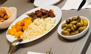 Daily typical plate of rice, potatoes and seitan, olives, and a kind of "porc" sandwich, spicy and juicy and yummy. at Lupin Snack Bar in Porto