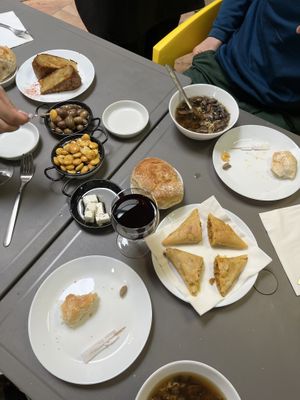A selection of foods to start - mushroom soup, vegan feta, chickpea flour tortilla, marinated olives & lupin beans and samosas   at Lupin Snack Bar in Porto