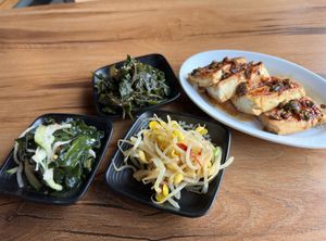 perilla leaf, seaweed cucumber salad, bean sprouts as basic complimentary side dishes plus tofu as special treat for us the regulars at Gangnam Style Korean Kitchen in Syracuse