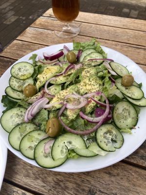 Salad looks big, but it is mainly lettuce, 4 olives , cucumber & half of an avocado for 7 €.   at Brasilia in Tenerife