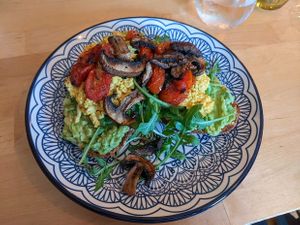 Loaded avocado toast with tofu scramble, mushrooms, tomatoes, for brunch at The Magic Sunflower in Dronfield
