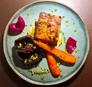 Portobello mushroom, glazed carrots, layered pumpkin entree. at Go Green The Restaurant in Luanda