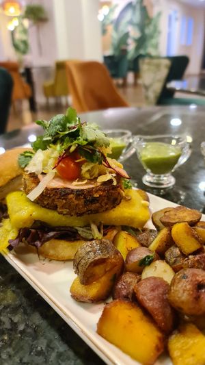 Pinto Bean Burger with extra vegan cheese (superb) at Biofilia - Botánica Coffee House in La Paz