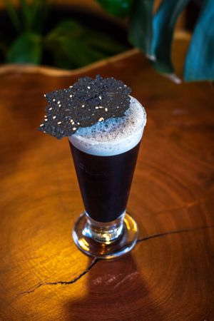 Lime juice sweetened with our homemade maple syrup, organic coconut activated
charcoal, ice and kombucha made of organic black tea steeped in jasmine flowers. at Biofilia - Botánica Coffee House in La Paz