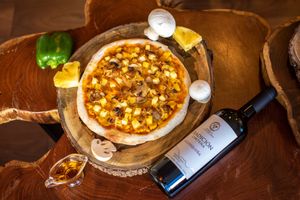 Homemade sourdough pizza with our made in house vegan cheese, fresh mushrooms and pineapple.  at Biofilia - Botánica Coffee House in La Paz