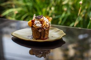 Vegan Cupcake

Wholesome sweets: vegan cupcake, topped with our homemade cream,
topped with fresh seasonal fruits and dehydrated fruits. at Biofilia - Botánica Coffee House in La Paz