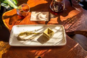 Pistachio mousse made with three homemade vegetable milks (rice, oat, coconut.) Homemade pistachio and matcha cookie,strawberries
and chia seeds gelé. at Biofilia - Botánica Coffee House in La Paz