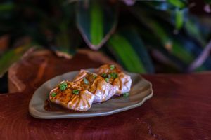Japanese pan-fried dumplings filled with fresh organic king oyster mushrooms, and vegetables sautéedin red wine, covered with a made in-house coffee sauce.  at Biofilia - Botánica Coffee House in La Paz