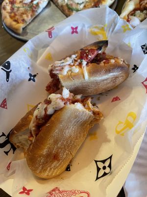 We ripped the vegan chicken park sandwich in half to share. It was yummy..not a lot of “chicken” though would be my only complaint.   at Spinelli's Pizza in Louisville