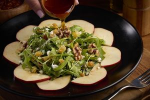 Dolce Piccant Salad.
Arugula, walnuts, golden raisins and apples tossed in olive oil, drizzled with spicy honey.
Request: no goat cheese for vegan option at Piola in Hallandale Beach