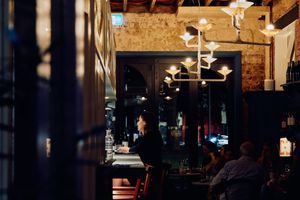 Have a seat at the bar  at Patsy's in Melbourne