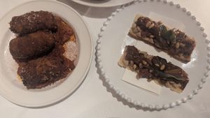 Crostini, eggplant caponata, pinenuts, fried sage $15.00: caper/fishy taste, bit tangy, didnt enjoy it; Fried potato+sweet corn croquettas w/almond romesco $18.00: ok at Patsy's in Melbourne