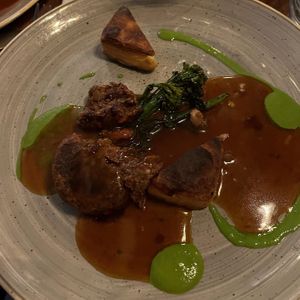 Nut roast with fondant potatoes and pea purée and vegan gravy   at Kitchen Danilo in Bridgwater