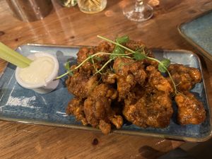 Cauliflower wings tossed in hot sauce, vegan blue cheese on the side   at Dolan's Pub and Restaurant in Limerick