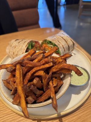 Buffalo wrap with sweet potato fries and jalapeño aioli  at Fresh Sherway in Toronto